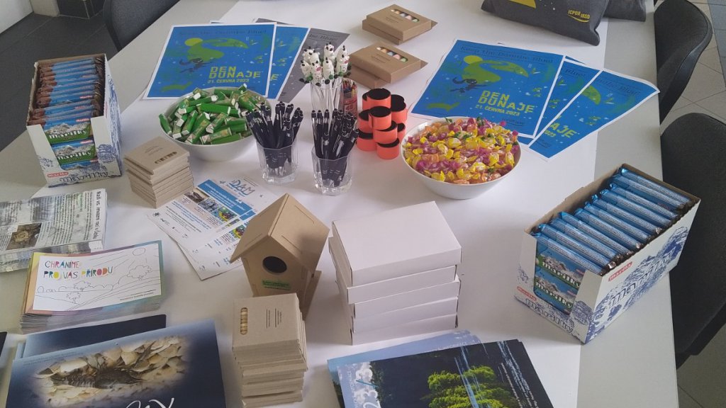 Posters and publications displayed on a table 