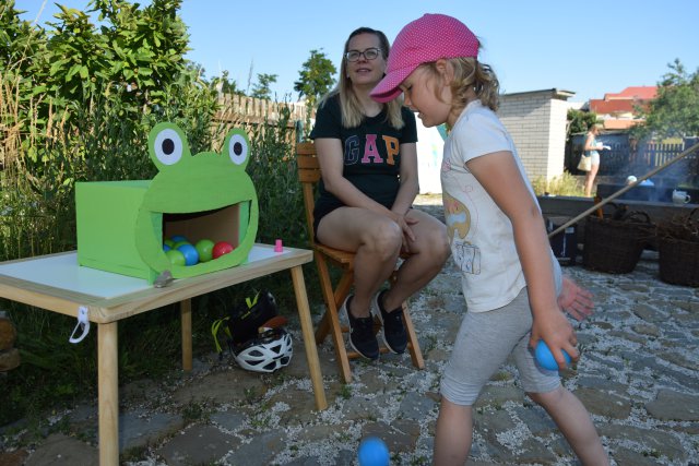 A young girl playing a game at a Danube Day event. 