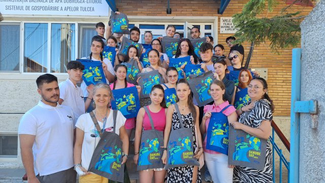 Students gathered outside with Danube Day 2025 tote bags.