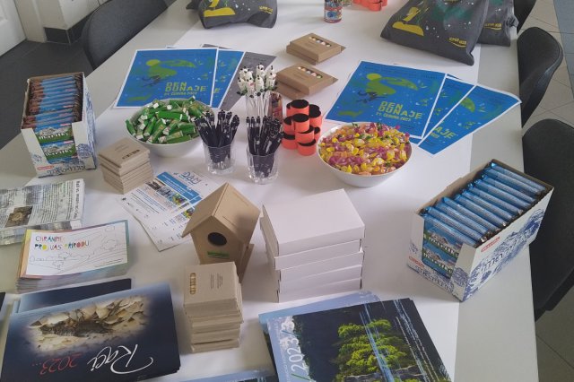 Posters and publications displayed on a table 