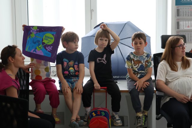Children posing with purple Danube dDay bags 